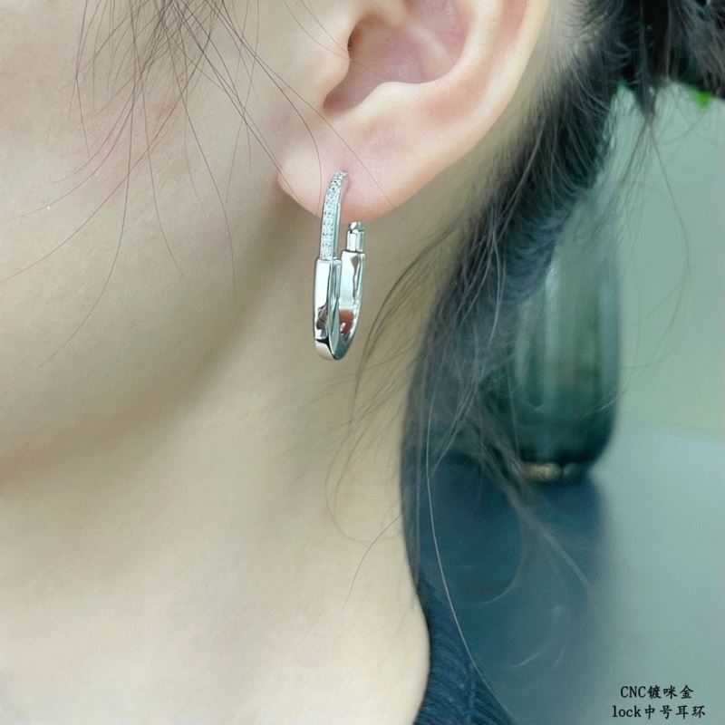 T*f*ny earrings